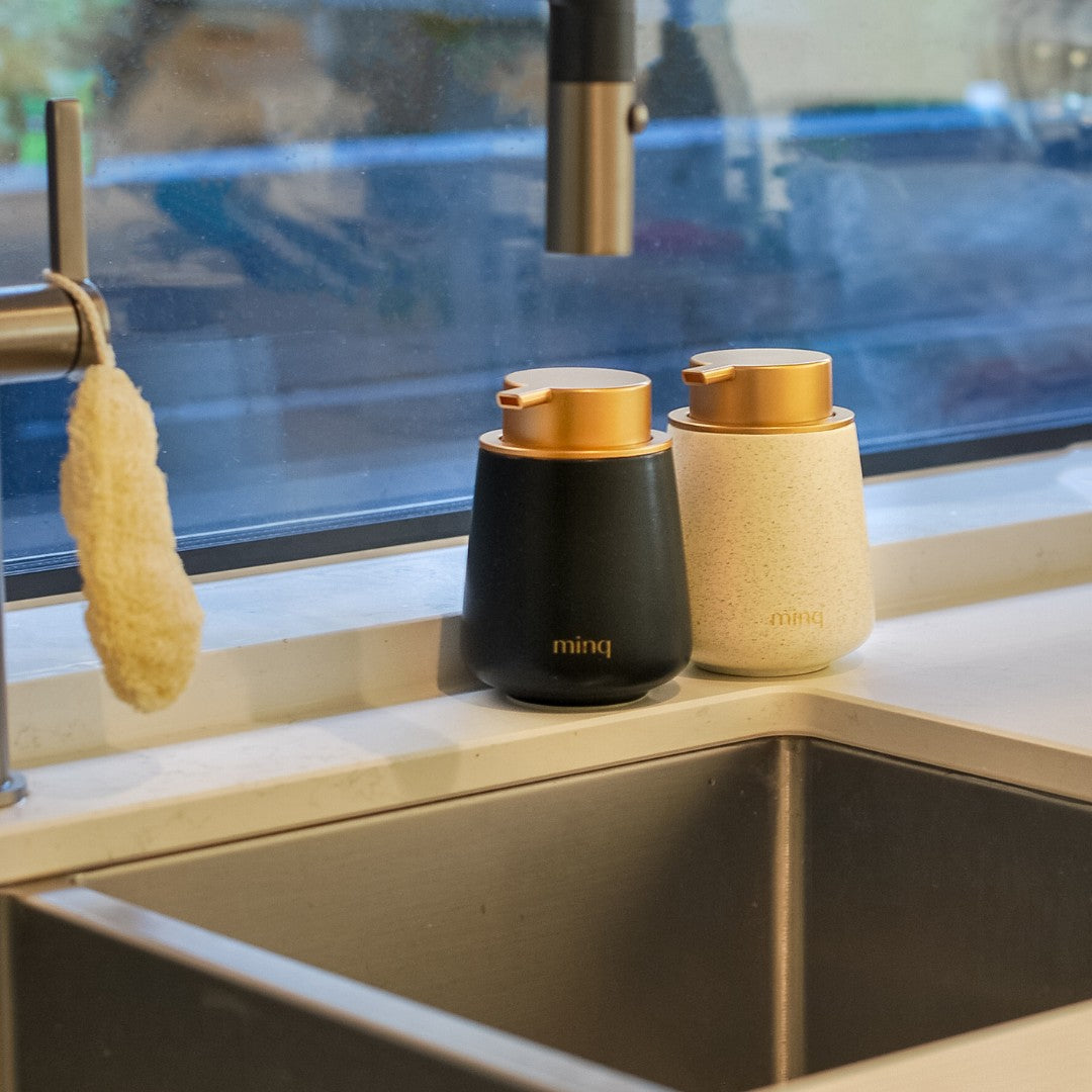 Ceramic handwash foam dispenser bottle next to sink